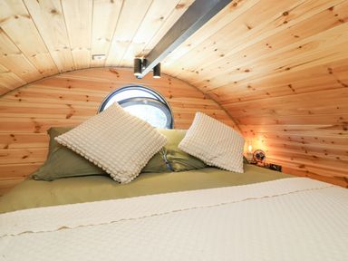 A bedroom with a bed and pillows at Bugley Pools Hideaway in Bugley near Gillingham