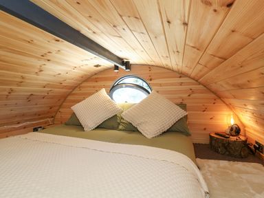 A bedroom with a bed and pillows at Bugley Pools Hideaway in Bugley near Gillingham
