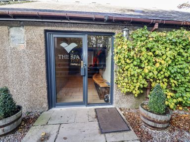 Entrance to a spa with plants at Honeymug in Branton near Powburn