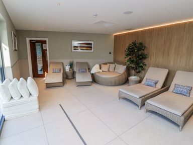 A relaxation area with loungers and a sofa at Honeymug in Branton near Powburn