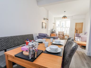 A dining room with a table set for meals at 1 Castle Terrace