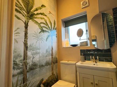 A bathroom with a sink and toilet at Bohemian Beach Cottage in Bournemouth