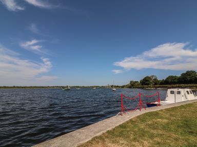 A view of water with boats and a pier at 1 Windermere, Kinvara, County Galway