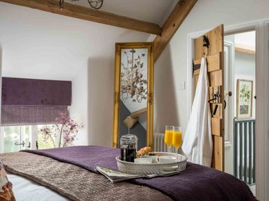 A bedroom with a bed and a tray on it at Lavender Cottage (Stow-on-the-Wold) Cheltenham