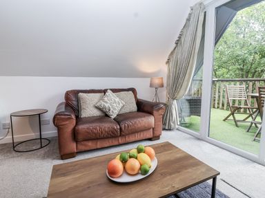 A living room with a sofa and a coffee table at Valley Lodge 20 Callington