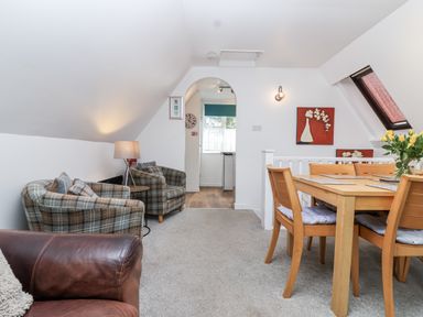 A living room with sofas and a dining table at Valley Lodge 20 Callington