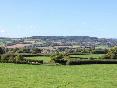 A view of green fields and hills at The Granary in Wyke Nr Axminster
