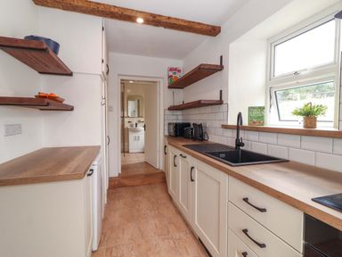 A kitchen with countertop and sink at The Farmhouse in Tralee, County Kerry
