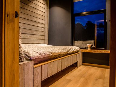 A bedroom with a bed and window at The Red House in Farndon