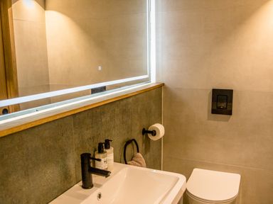 A bathroom featuring a wash basin and toilet at The Larch House in Farndon