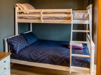 A bunk bed with sheets and pillows at The Larch House Farndon