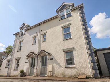 A two-story building exterior with two doors at Swirl Howe in Keswick