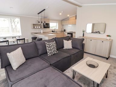 A living room with a sofa and table at Dolphin in Haverfordwest