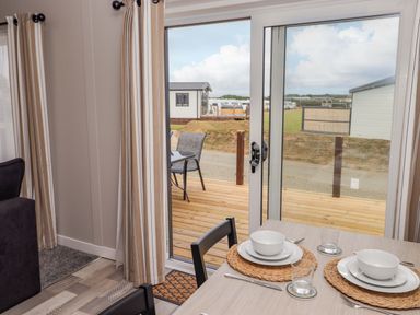 A dining area with a table set for meal at Dolphin in Haverfordwest