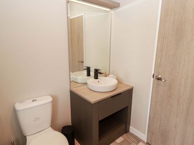 A bathroom with a toilet and sink at Dolphin in Haverfordwest