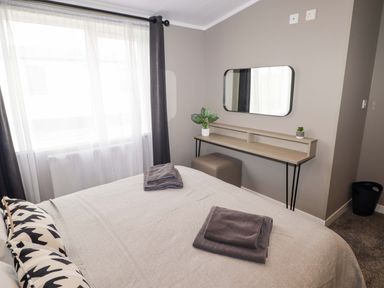 A bedroom with a bed and desk at Dolphin in Haverfordwest