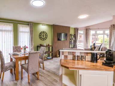 A kitchen and dining area with a table and chairs at Badgers Retreat - Two Dales Richmond