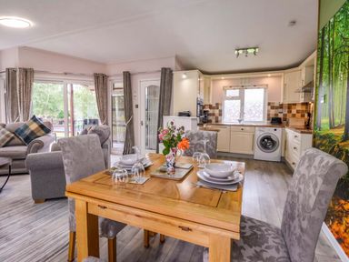 A dining area with table and chairs at Badgers Retreat - Two Dales in Richmond