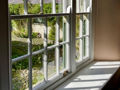 A window with a view of a garden at West Cottage in Myddfai near Llandovery
