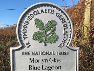 Sign indicating Morlyn Glas Blue Lagoon at The National Trust