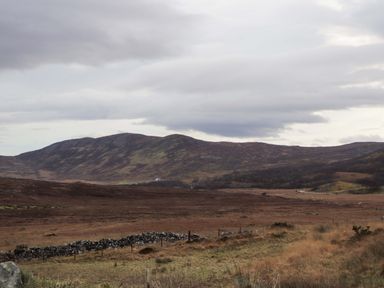 A landscape view of mountains and fields at The Pod at Greenbank Isle of Skye
