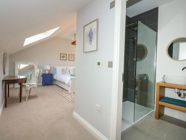 A bedroom with a shower area at Criw in Bryncroes near Sarn Meyllteyrn