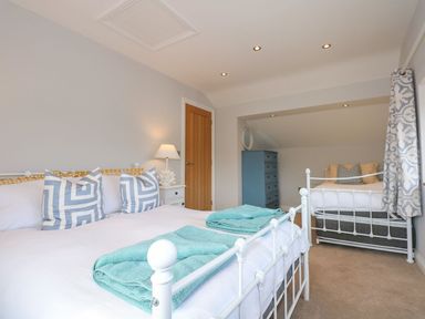 A bedroom with beds and pillows at Criw in Bryncroes near Sarn Meyllteyrn