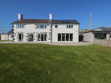 A house with sliding doors and windows at Criw in Bryncroes near Sarn Meyllteyrn
