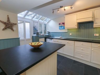 A kitchen with a bowl on the countertop at Zenobia in New Quay