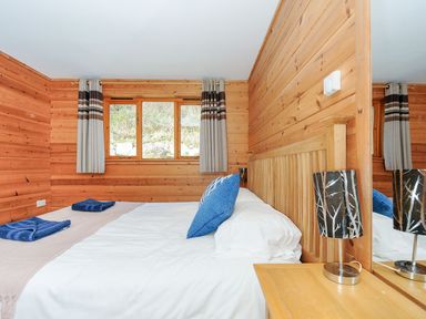 A bedroom with a bed and a window at Trevano in St Breward