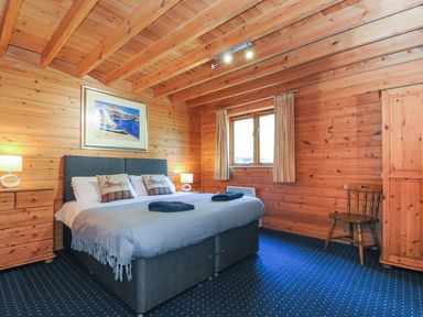 A bedroom with a bed and a window at Eden in St Breward
