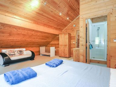A bedroom with a bed and shower at Eden in St Breward