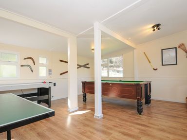 A games room with a pool table and air hockey table at Eden in St Breward