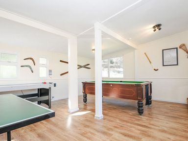 A games room with a pool table and air hockey table at Polzeath in St Breward