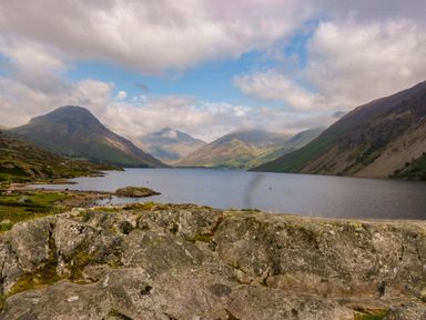 A scenic view of a lake surrounded by mountains at Buckbarrow in Seascale