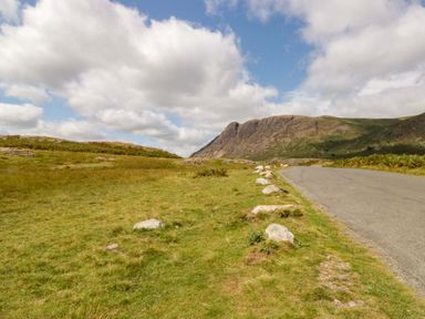 A landscape with a mountain and a road at Buckbarrow Seascale