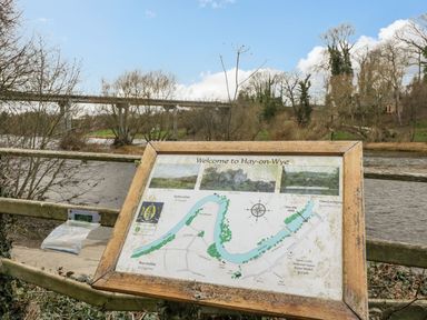 An information sign with a map by a river at Cariad Cottage Hereford