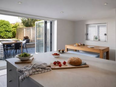 A kitchen with food items and outdoor access at Wood Cottage