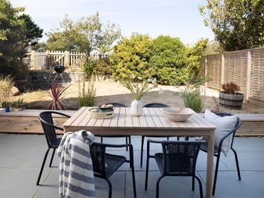 A dining area with a table and chairs at Wood Cottage