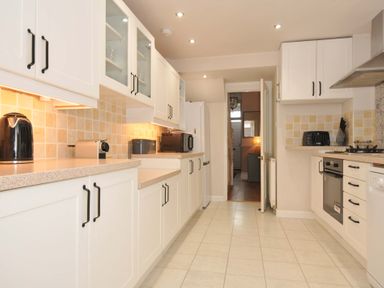 A kitchen with appliances and cabinetry at Overdale