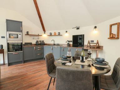 A kitchen with a dining area at Y Cwlwm in Lampeter