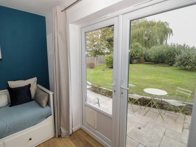 A living room with a view of the garden at Harran in Pershore
