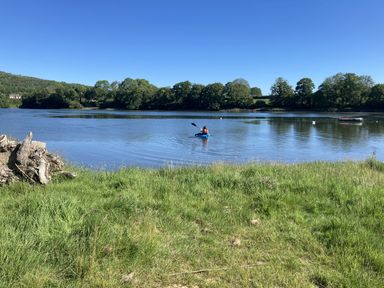 A person in a kayak on a lake at Penally Mews in St Dogmaels