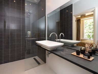 A bathroom with a shower and sink at The Old Vicarage in St Issey
