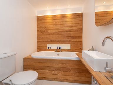 A bathroom with a bathtub and sink at The Old Vicarage in St Issey