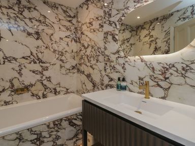 A bathroom with a bathtub and sink at The Boundary in Windermere