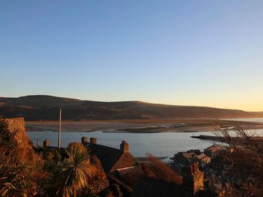 A landscape view of hills and water at The Ingle in Barmouth