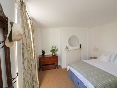 A bedroom with a bed and dresser at 36 Crowthers Hill in Dartmouth