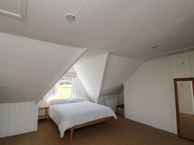 A bedroom with a bed and window at 36 Crowthers Hill in Dartmouth