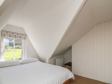 A bedroom with a bed and window at 36 Crowthers Hill in Dartmouth